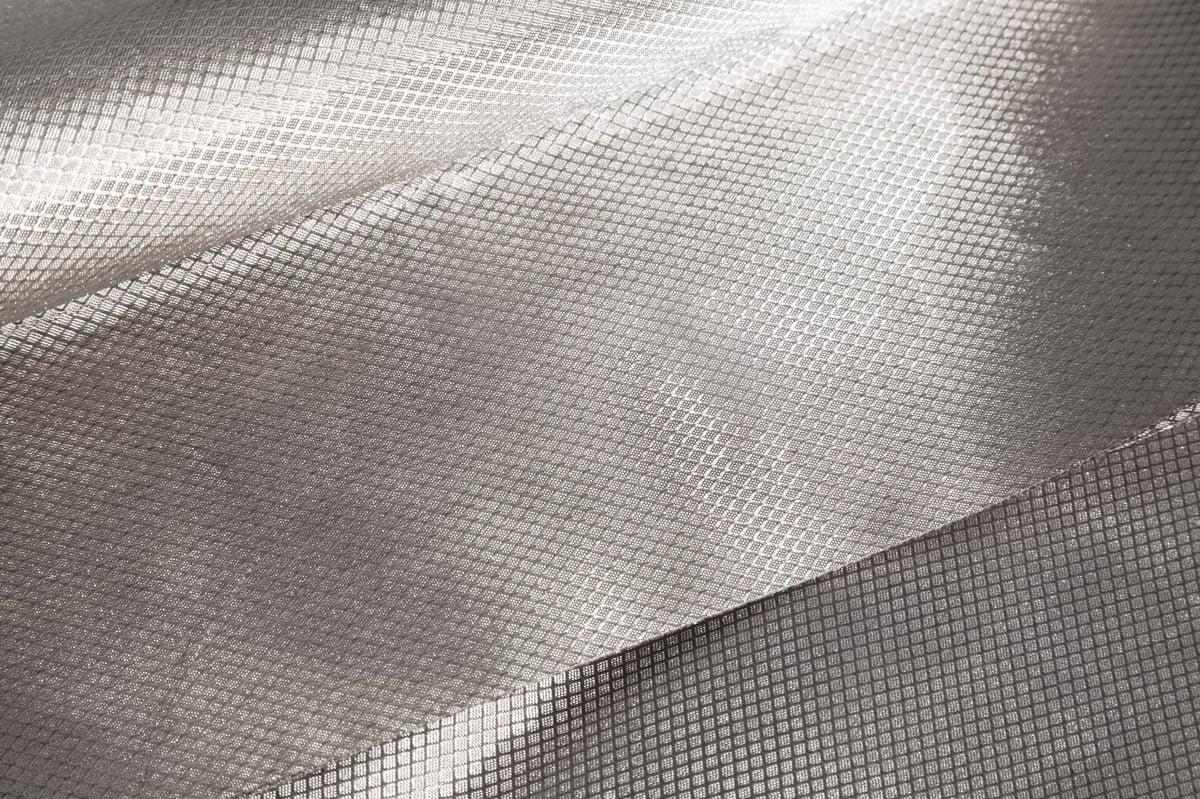 Shielding conductive cloth with metal grid that blocks wireless signals, EMF radiation